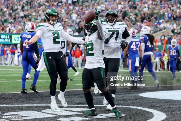 Michael Carter of the New York Jets celebrates a rushing touchdown in the first half of a game against the Buffalo Bills at MetLife Stadium on...