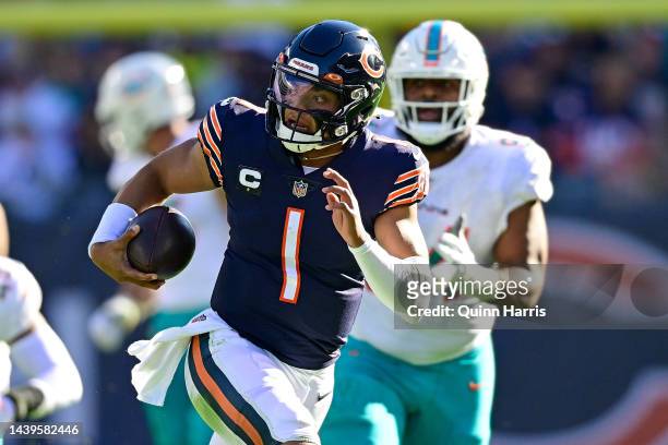 Justin Fields of the Chicago Bears runs the ball during the second half in the game against the Miami Dolphins at Soldier Field on November 06, 2022...