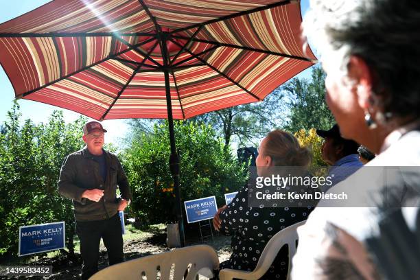 Sen. Mark Kelly talks to volunteers at a backyard rally on November 06, 2022 in Tucson, Arizona. With two days to go before election day, current...