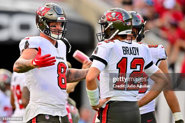 Kyle Rudolph of the Tampa Bay Buccaneers talks with Tom Brady prior to the game against the Los Angeles Rams at Raymond James Stadium on November 06,...