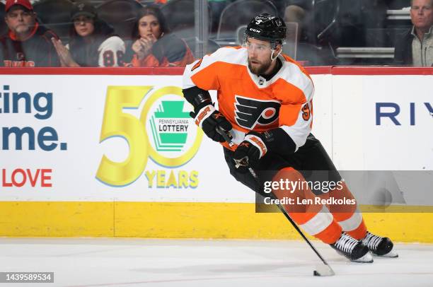 Ivan Provorov of the Philadelphia Flyers skates the puck against the Carolina Hurricanes at the Wells Fargo Center on October 29, 2022 in...