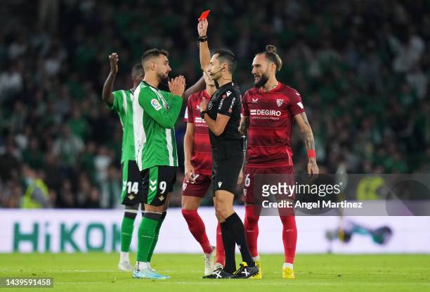 Referee Jose Maria Sanchez Martinez shows a red card to Borja Iglesias of Real Betis during the LaLiga Santander match between Real Betis and Sevilla...