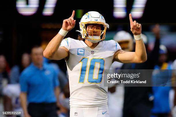 Justin Herbert of the Los Angeles Chargers reacts after a play during the fourth quarter in the game against the Atlanta Falcons at Mercedes-Benz...
