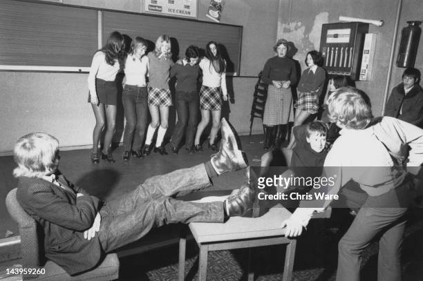 Teenage girls dance together, while teenage boys look on, at a Saturday morning disco run by the Zetters leisure company in Wolverhampton, 15th...