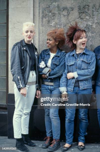 Three teenage girls wearing post punk fashions, 1980.