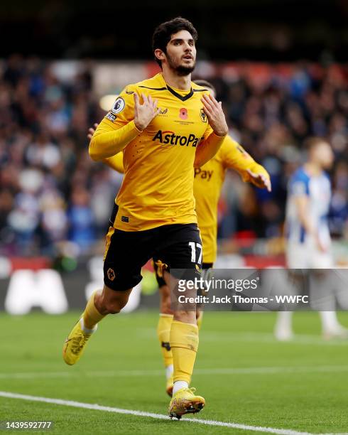 Goncalo Guedes of Wolverhampton Wanderers celebrates after scoring his team's first goal during the Premier League match between Wolverhampton...