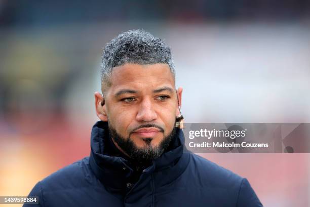 Television pundit Jobi McAnuff looks on during the Emirates FA Cup First Round game between Wrexham and Oldham Athletic at Racecourse Ground on...