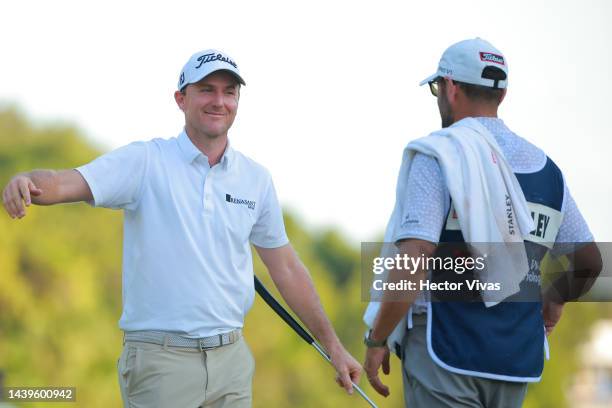 Russell Henley of United States celebrates with his caddie after winning the championship after the the final round of the World Wide Technology...