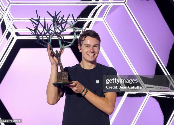 Winner Holger Rune of Denmark poses with the trophy after beating Novak Djokovic of Serbia in the final during day 7 of the Rolex Paris Masters 2022,...
