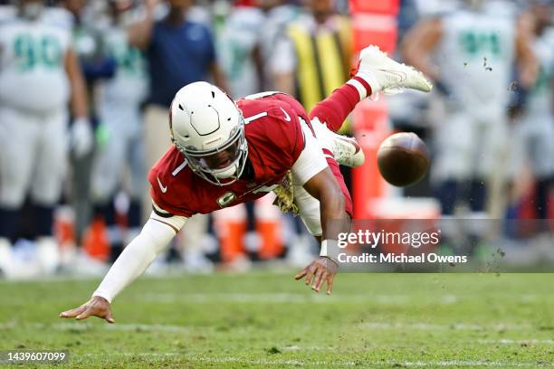 Kyler Murray of the Arizona Cardinals dives as he fumbles against the Ryan Neal of the Seattle Seahawks during an NFL Football game between the...