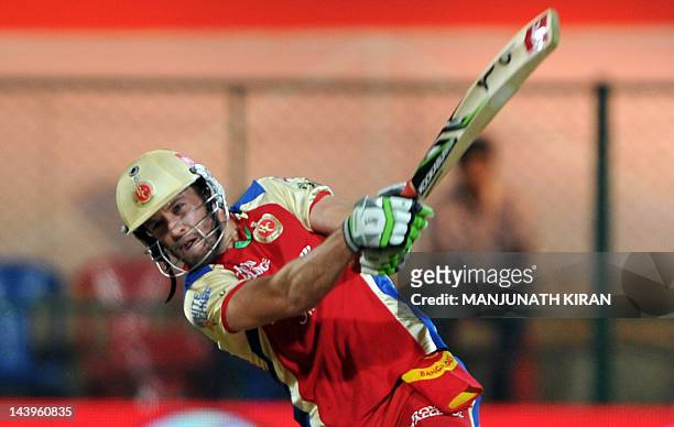 Royal Challengers Bangalore batsmen AB DeVilliers plays a shot during the IPL Twenty20 cricket match against Deccan Chargers at the M. Chinnaswamy...