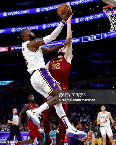 LeBron James of the Los Angeles Lakers takes a shot against Dean Wade of the Cleveland Cavaliers in the second half at Crypto.com Arena on November...