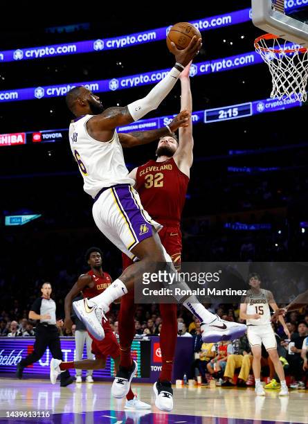 LeBron James of the Los Angeles Lakers takes a shot against Dean Wade of the Cleveland Cavaliers in the second half at Crypto.com Arena on November...