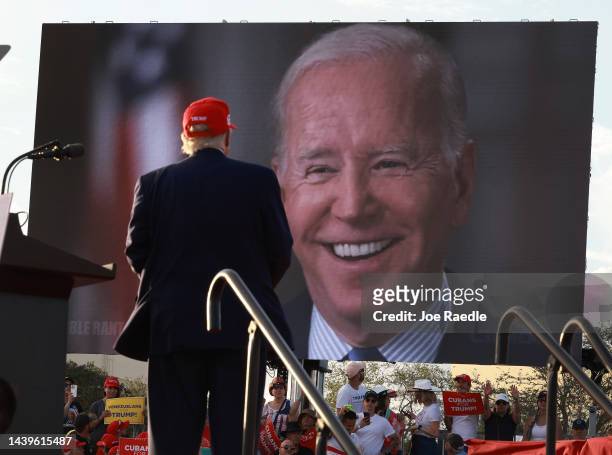 Former U.S. President Donald Trump watches a video of President Joe Biden playing during a rally for Sen. Marco Rubio at the Miami-Dade Country Fair...