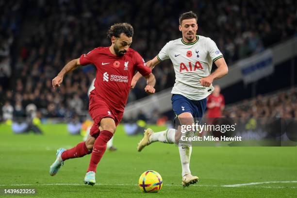 Mohamed Salah of Liverpool is challenged by Clement Lenglet of Tottenham Hotspur during the Premier League match between Tottenham Hotspur and...