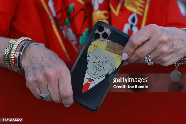 Supporter of former U.S. President Donald Trump holds a mobile phone with a Trump cover during a rally for Sen. Marco Rubio at the Miami-Dade Country...