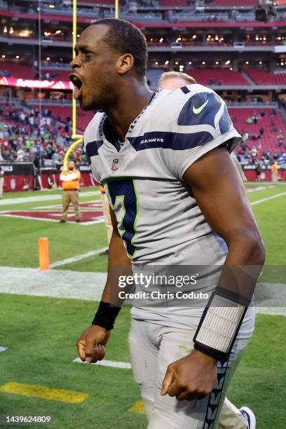Geno Smith of the Seattle Seahawks walks off the field after the Seahawks defeat the Arizona Cardinals 31-21 in the game at State Farm Stadium on...