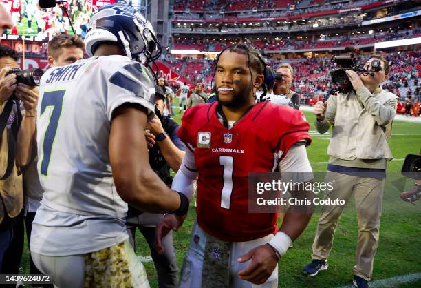 Geno Smith of the Seattle Seahawks and Kyler Murray of the Arizona Cardinals shake hands after the game at State Farm Stadium on November 06, 2022 in...