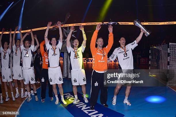 Thierry Omeyer and Marcus Ahlm of Kiel celebrate with the trophy after winning The Lufthansa Final 4 match between THW Kiel and SG Flensburg -...