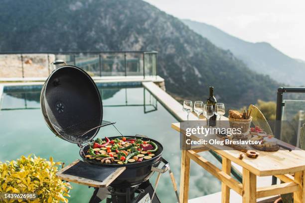 poolside barbecue party outdoors at sunset. vegetables on grill - vegan background stock pictures, royalty-free photos & images