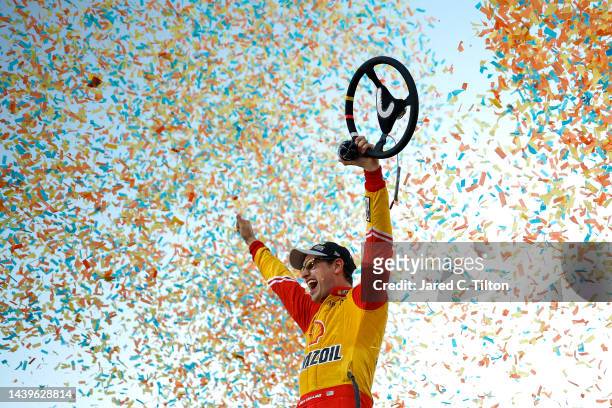 Joey Logano, driver of the Shell Pennzoil Ford, celebrates in victory lane after winning the 2022 NASCAR Cup Series Championship at Phoenix Raceway...