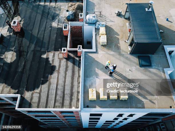 aerial drone shot of a construction site - telhado imagens e fotografias de stock