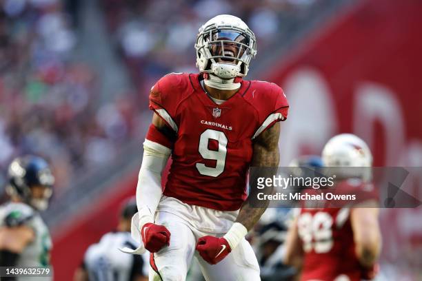 Isaiah Simmons of the Arizona Cardinals celebrates after sacking Geno Smith of the Seattle Seahawks during an NFL Football game between the Arizona...