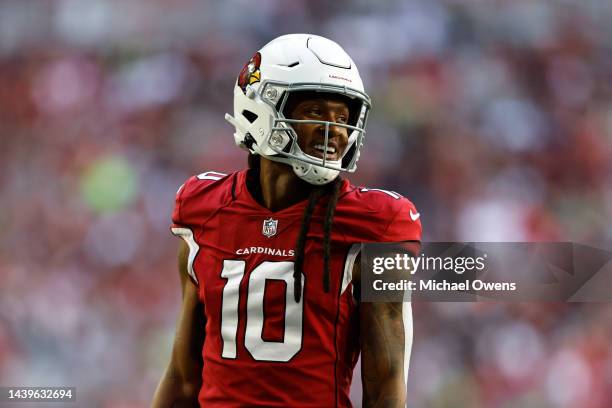 DeAndre Hopkins of the Arizona Cardinals reacts as he looks on during an NFL Football game between the Arizona Cardinals and the Seattle Seahawks at...