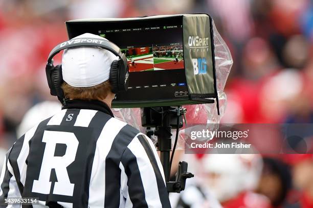 The officials watch instant replay on a potential touchdown catch during the game between the Wisconsin Badgers and Maryland Terrapins at Camp...