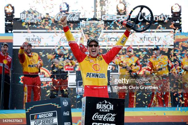 Joey Logano, driver of the Shell Pennzoil Ford, celebrates in victory lane after winning the 2022 NASCAR Cup Series Championship at Phoenix Raceway...
