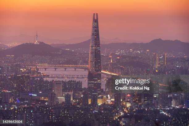 seoul skyline with lotte tower at sunset - lotte world tower stock pictures, royalty-free photos & images