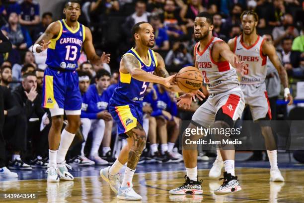 Shabazz Napier of the Mexico City Captains dribbles as Cassius Stanley of the Rio Grande Valley Vipers defends during the first half of the NBA...