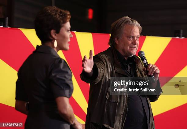 Arizona Republican gubernatorial candidate Kari Lake looks on as Steve Bannon speaks during a get out the vote campaign rally on November 05, 2022 in...