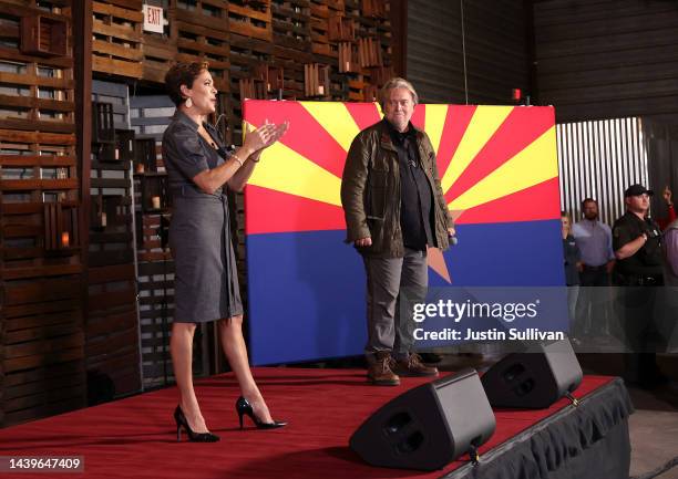 Arizona Republican gubernatorial candidate Kari Lake speaks as Steve Bannon looks on during campaign rally on November 05, 2022 in Queen Creek,...