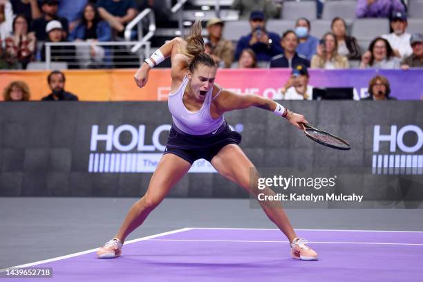 Aryna Sabalenka of Belarus celebrates after defeating Iga Swiatek of Poland in their Women's Singles Semifinal match during the 2022 WTA Finals, part...