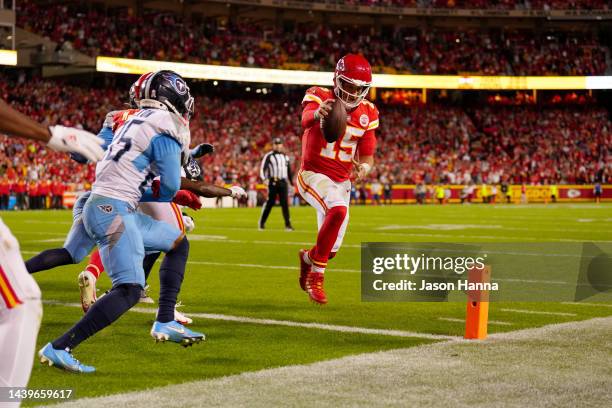Patrick Mahomes of the Kansas City Chiefs runs in for a two-point conversion to tie their game against the Tennessee Titans in the fourth quarter at...