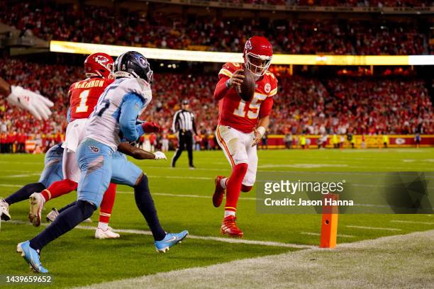 Patrick Mahomes of the Kansas City Chiefs runs in for a two-point conversion to tie their game against the Tennessee Titans in the fourth quarter at...