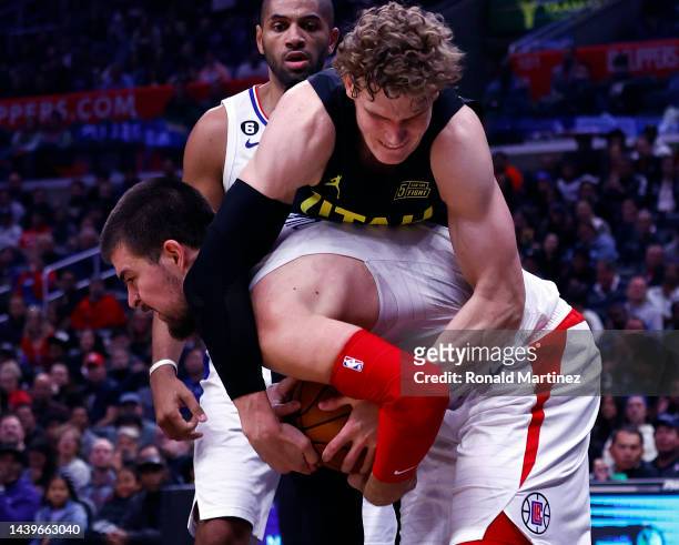 Lauri Markkanen of the Utah Jazz gets a jump ball against Ivica Zubac of the LA Clippers in the second half at Crypto.com Arena on November 06, 2022...
