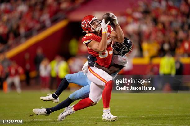 Noah Gray of the Kansas City Chiefs catches the ball while covered by Roger McCreary of the Tennessee Titans in overtime at Arrowhead Stadium on...