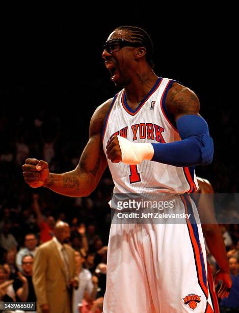 Amare Stoudemire of the New York Knicks reacts after he dunked in the first half against the Miami Heat in Game Four of the Eastern Conference...