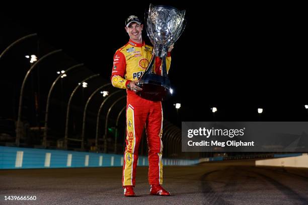 Joey Logano, driver of the Shell Pennzoil Ford, poses with the Bill France NASCAR Cup Series Championship trophy after winning the 2022 NASCAR Cup...