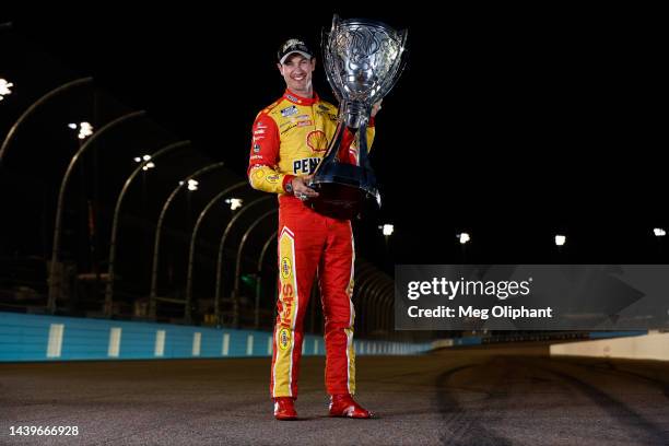 Joey Logano, driver of the Shell Pennzoil Ford, poses with the Bill France NASCAR Cup Series Championship trophy after winning the 2022 NASCAR Cup...