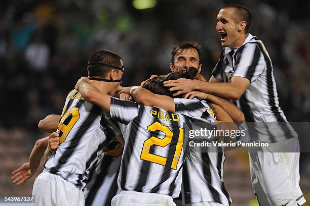 Players of Juventus FC celebrate after beating Cagliari Calcio 2-0 to win the Serie A Championships during the Serie A match between Cagliari Calcio...