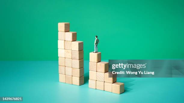 man climbing corporate ladder gap , business working challenge - achievement gap stock pictures, royalty-free photos & images