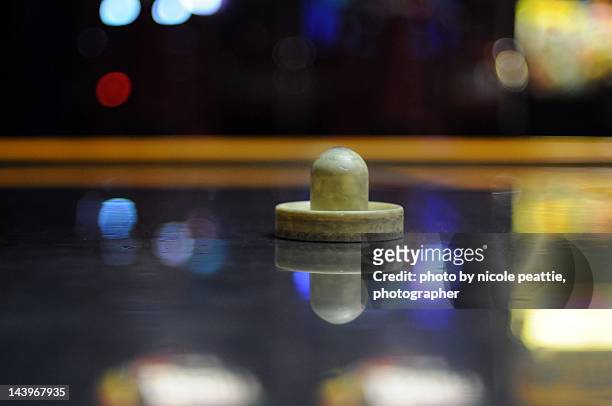 air hockey table - air hockey puck stock pictures, royalty-free photos & images