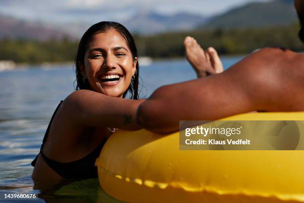 cheerful woman laughing by male friend - swimsuit girlfriend stock pictures, royalty-free photos & images