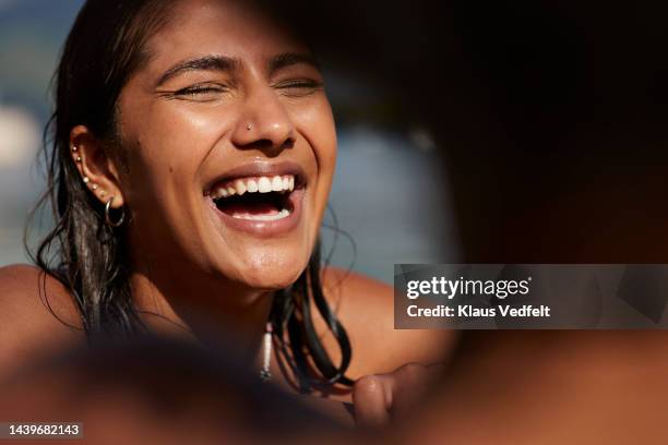 happy young woman laughing with eyes closed - pierced nose stock pictures, royalty-free photos & images