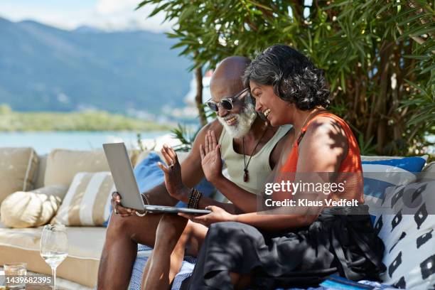 couple gesturing while doing video call - zoom chat red stock pictures, royalty-free photos & images