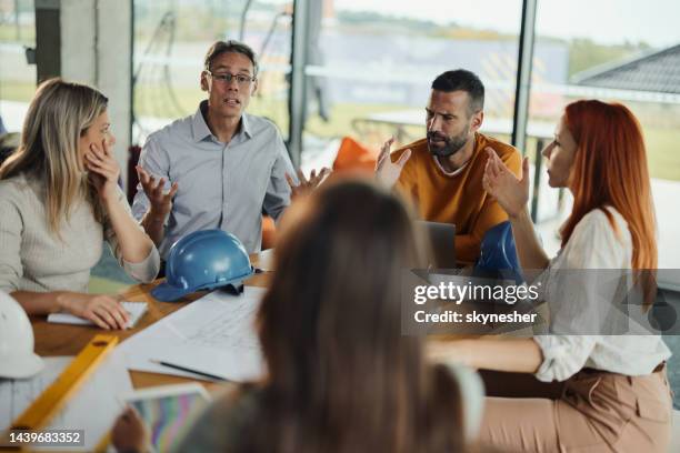 frustrated architects arguing on a meeting in the office. - adults arguing stock pictures, royalty-free photos & images