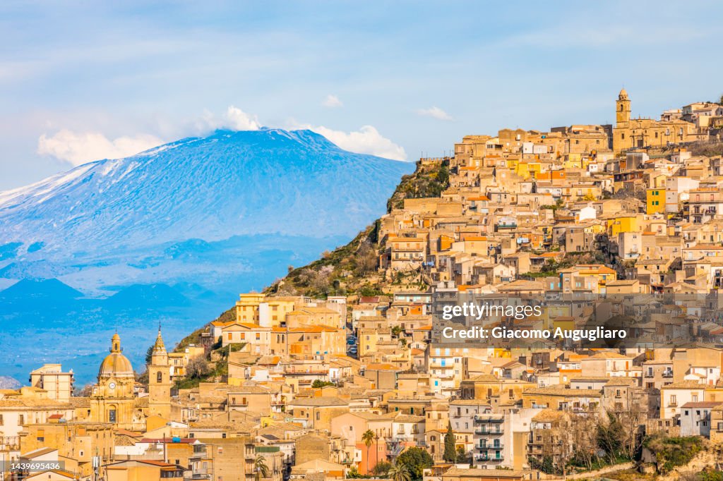 Agira village and the Mount Etna in the background, Catania province, Sicily, italy